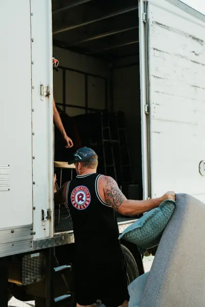 Brisbane removalists loading furniture into Relocation Rangers truck